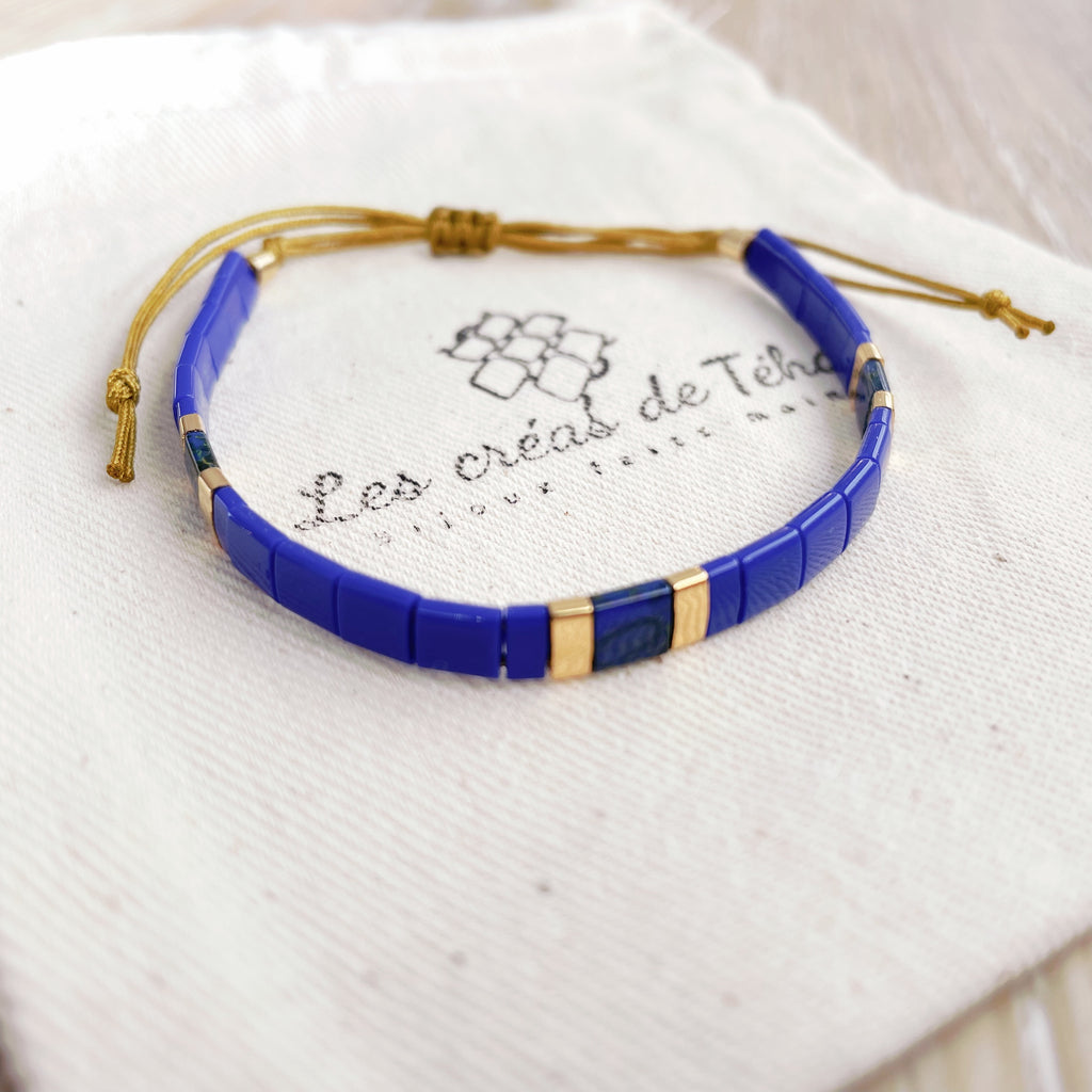 Bracelet Huira bleu et doré en perles de verre et cordon