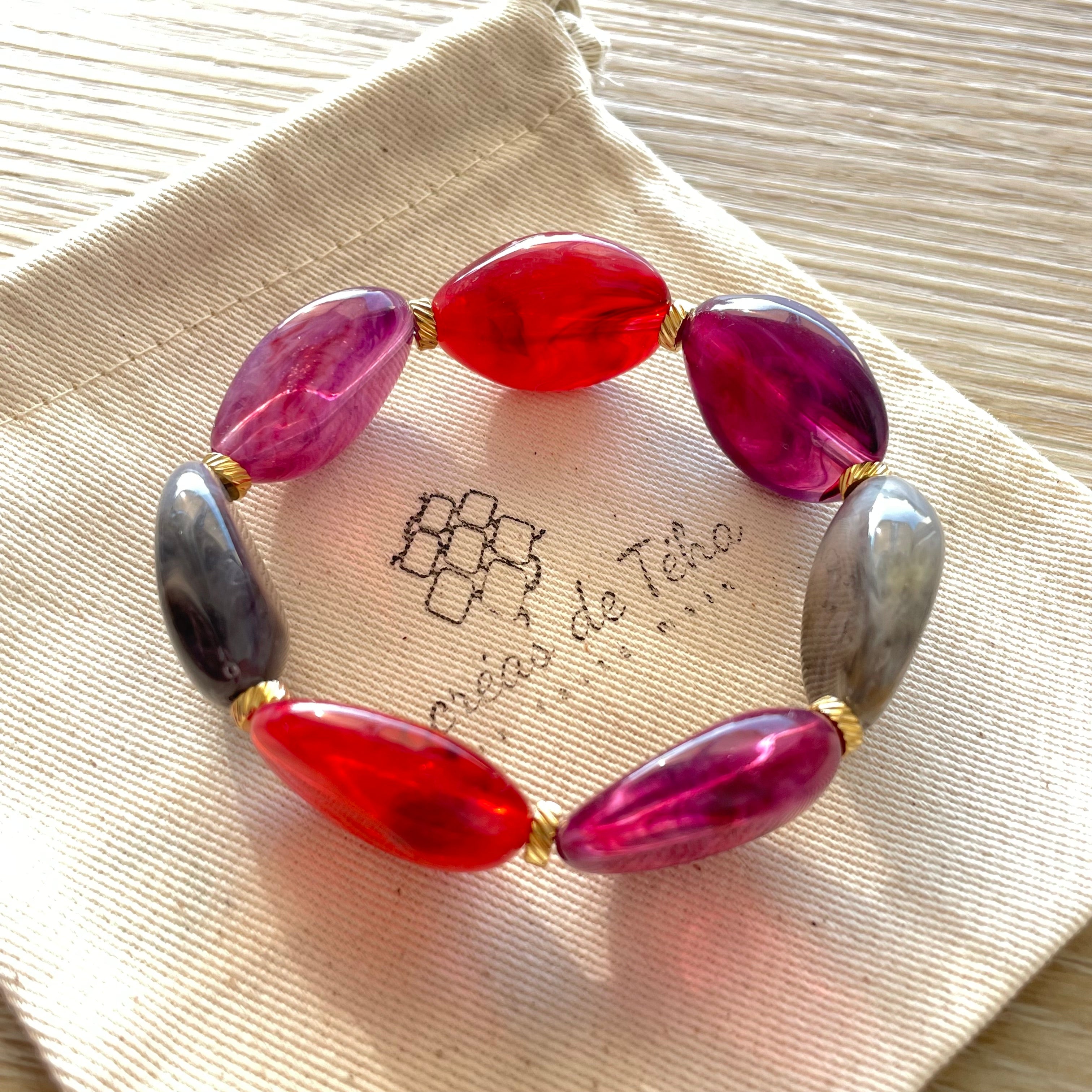 Bracelet élastique en perles acrylique et acier inoxydable modèle Joia