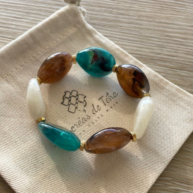 Bracelet élastique en perles acrylique et acier inoxydable modèle Joia