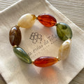 Bracelet élastique en perles acrylique et acier inoxydable modèle Joia