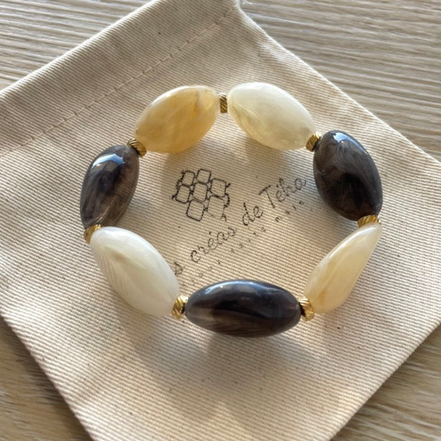 Bracelet élastique en perles acrylique et acier inoxydable modèle Joia