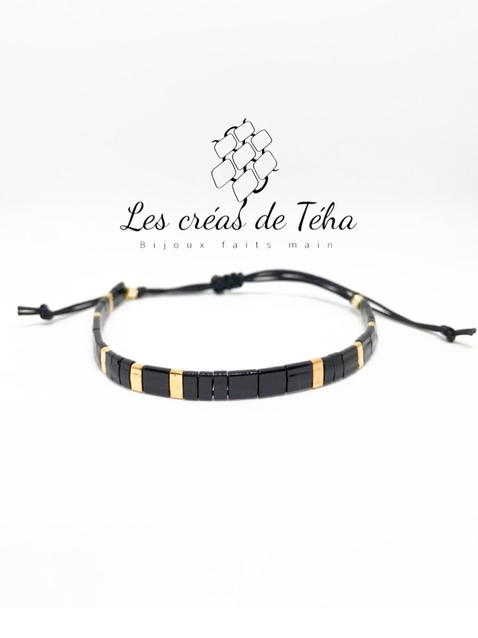 Bracelet Huira noir et doré en perles de verre et cordon