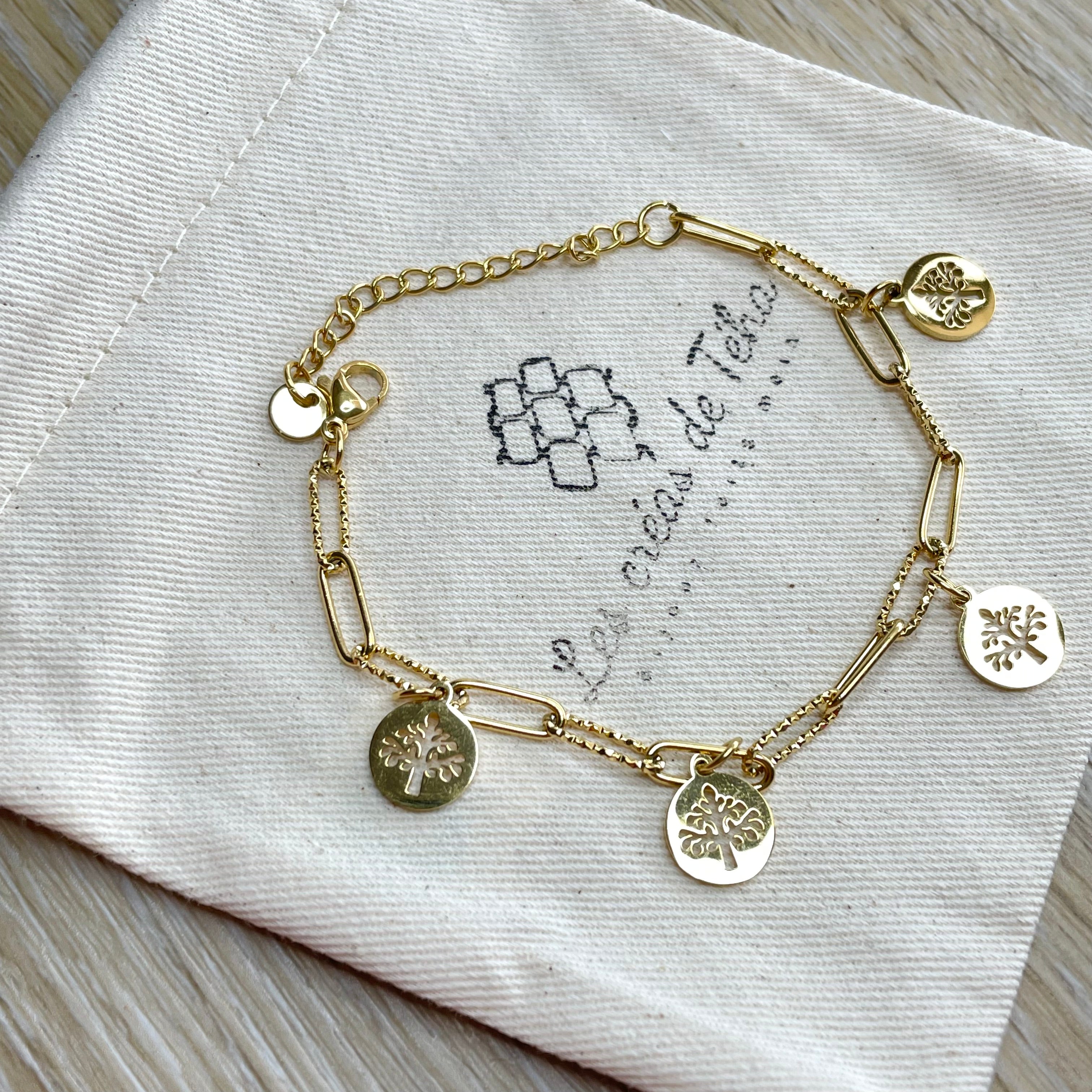 Bracelet réglable en acier inoxydable doré avec breloques modèle Auro