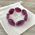 Bracelet élastique en perles acrylique et acier inoxydable modèle Joia