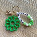 Porte-clés bijou de sac avec breloque fleur en résine modèle Flower
