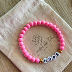 Bracelet élastique en perles acrylique et acier inoxydable modèle Hope