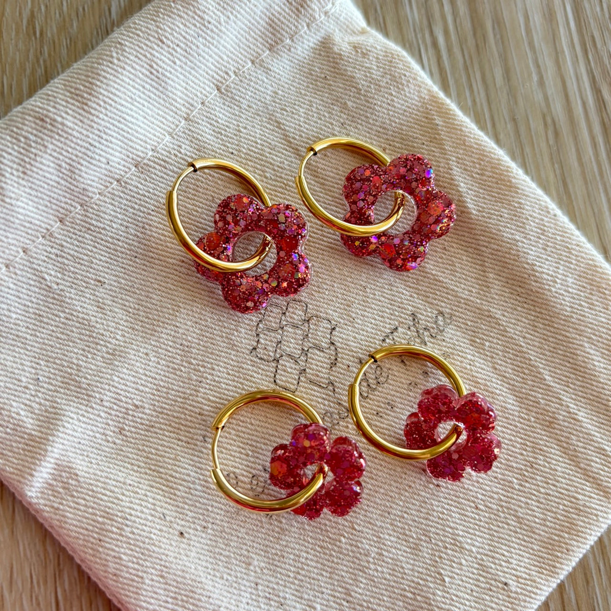 Pampilles interchangeables avec ou sans créoles modèle Flower Octobre rose